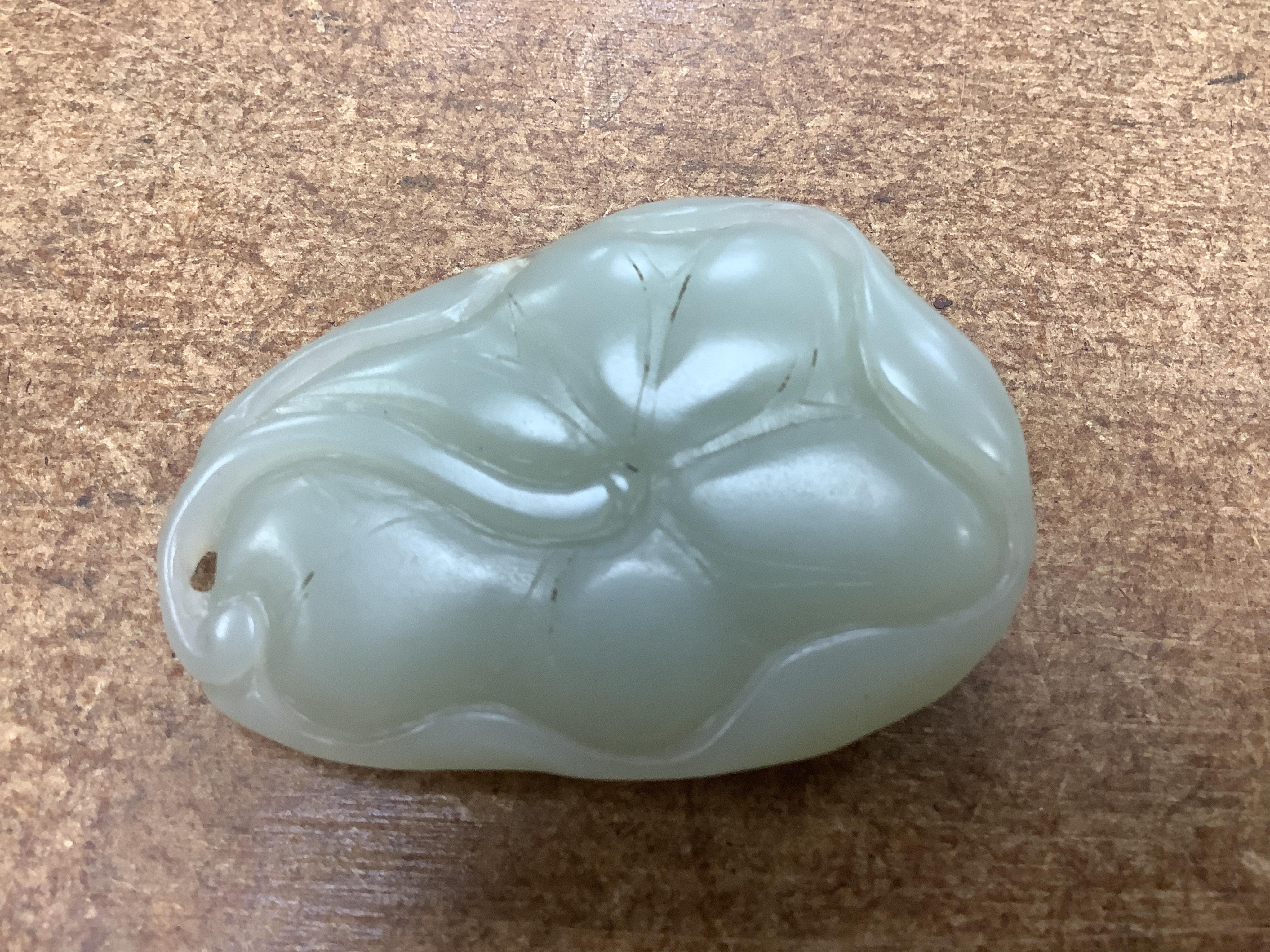 Sixteen Chinese jade and hardstone carvings, including a gilded white metal and jadeite bracelet, three pendants etc. Condition - fair
